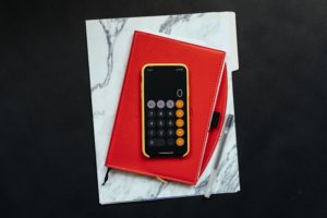 Calculator Red Notebook and Marble