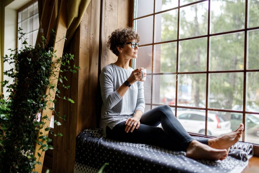 woman sitting by window