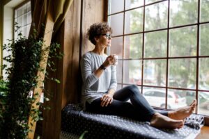 woman sitting by window