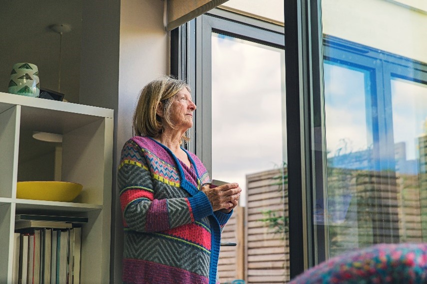 woman looking out window