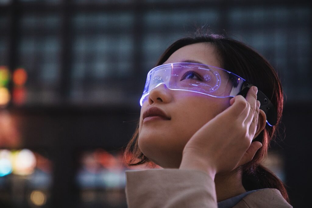 Young woman looking through high tech glasses